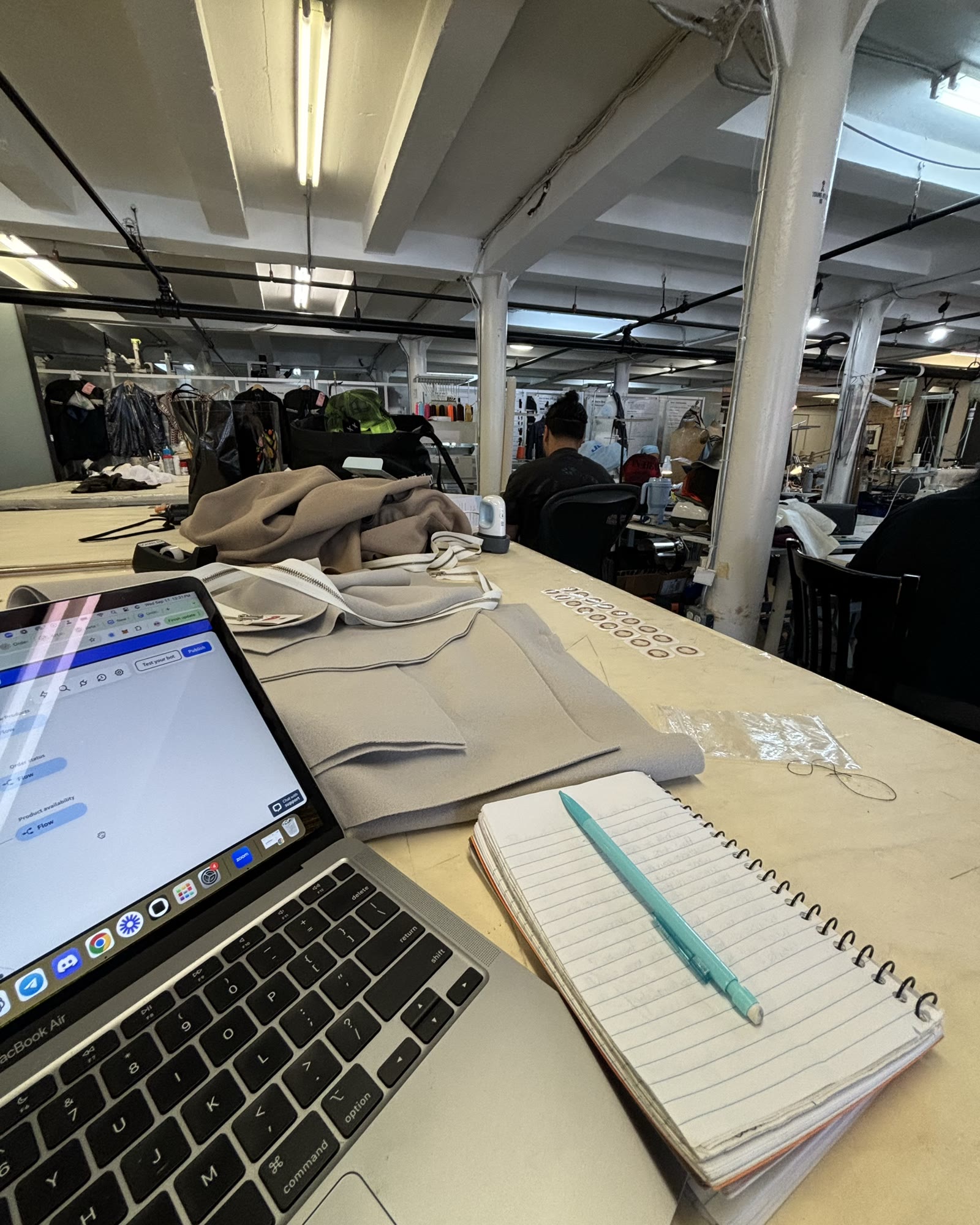 Laptop and notebook on the studio table