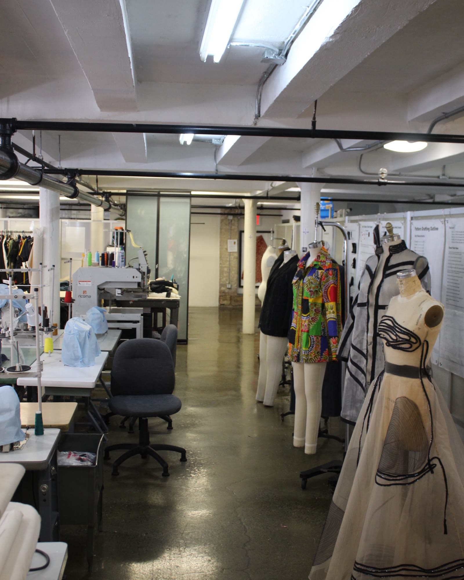 Studio floor with dress forms and sewing tables