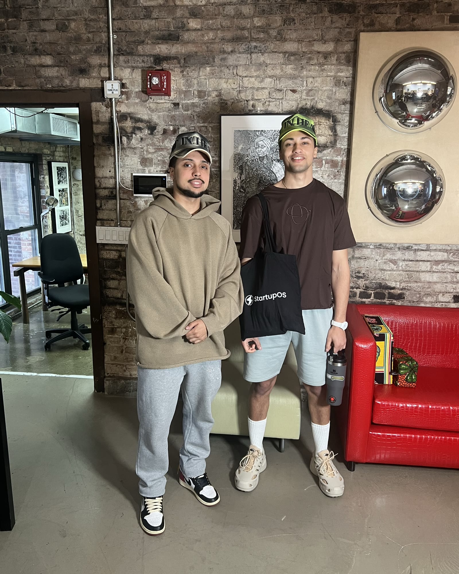 Two people standing in a studio