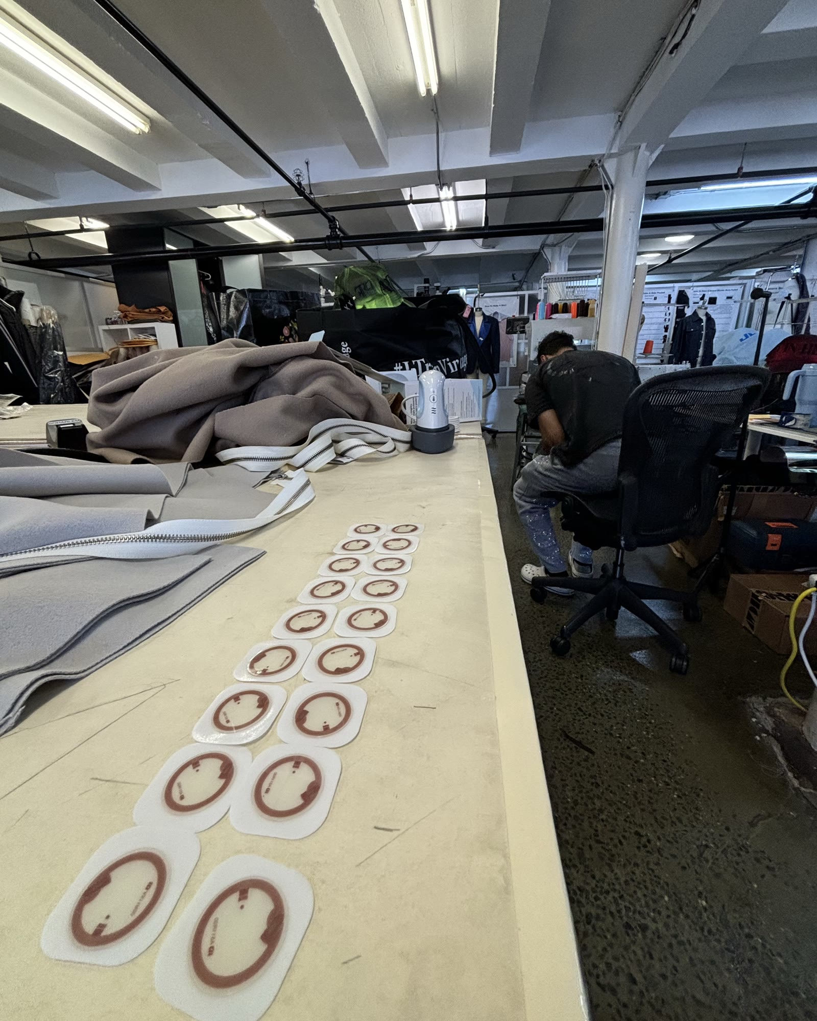 A row of round NFC tags laid out on a table