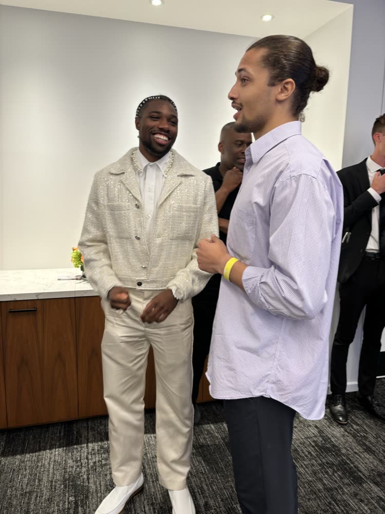 Brandon Webster with a guest at an event