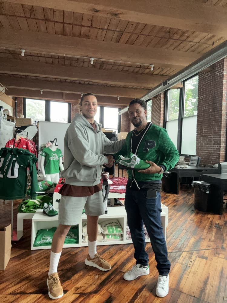 A handoff in a loft showroom